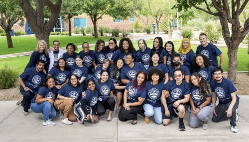 Diversity Council students gather for a group photo outside.