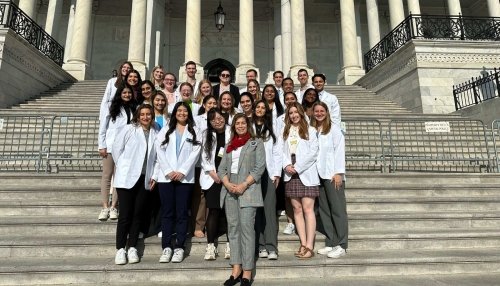 CCOM stand outside Capitol Hill.