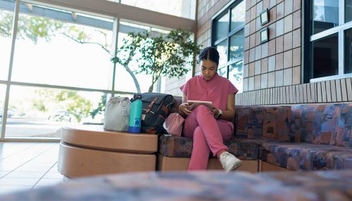 Student studying in lobby area.