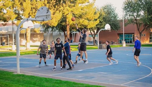 Students playing basketball.