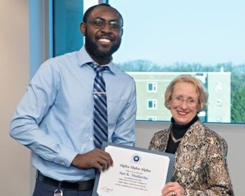 Sun Mudiavita is inducted into the honor society.